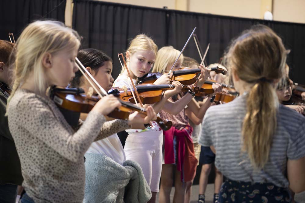 Class 3string orchestra playing violin
